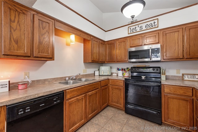 kitchen featuring sink, black appliances, and light tile patterned flooring