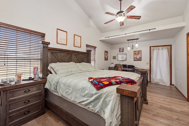 bedroom featuring lofted ceiling and light hardwood / wood-style floors