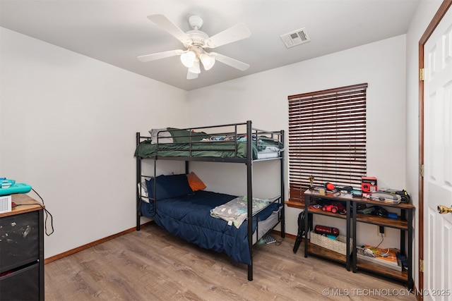 bedroom featuring ceiling fan and light hardwood / wood-style floors