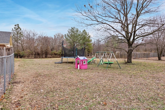 exterior space with a yard and a trampoline