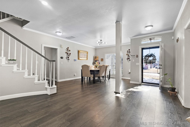 entryway featuring crown molding and dark hardwood / wood-style floors