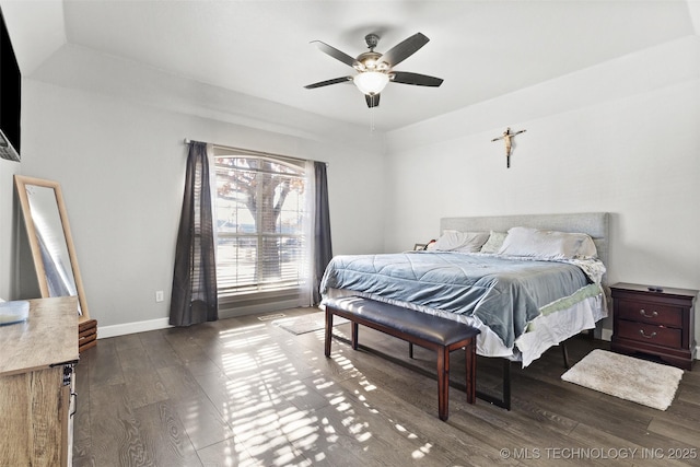 bedroom with dark wood-type flooring and ceiling fan