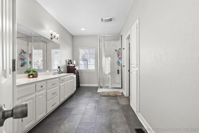 bathroom with vanity and an enclosed shower