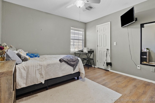 bedroom featuring hardwood / wood-style flooring and ceiling fan