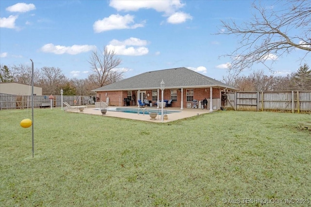 back of house featuring a fenced in pool and a patio area