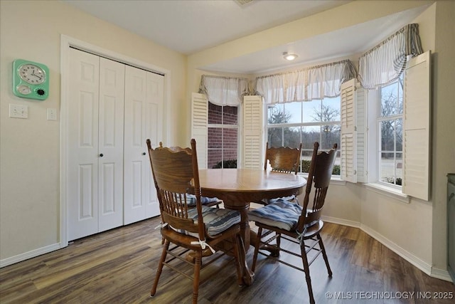 dining area featuring dark hardwood / wood-style floors