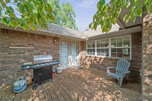 wooden terrace with area for grilling