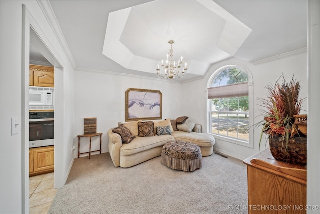 sitting room with ornamental molding, light colored carpet, and a notable chandelier