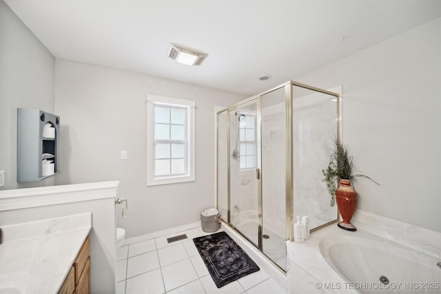 full bathroom featuring vanity, tile patterned flooring, toilet, and separate shower and tub