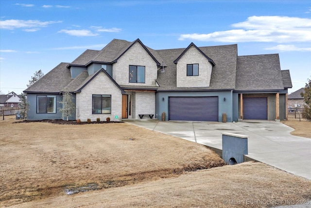 french country style house featuring a garage