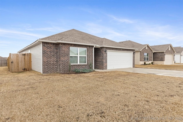 ranch-style home featuring a garage and a front yard