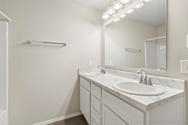 bathroom featuring vanity and hardwood / wood-style flooring