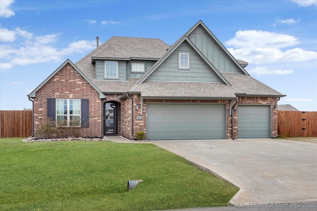 view of front facade with a garage and a front lawn