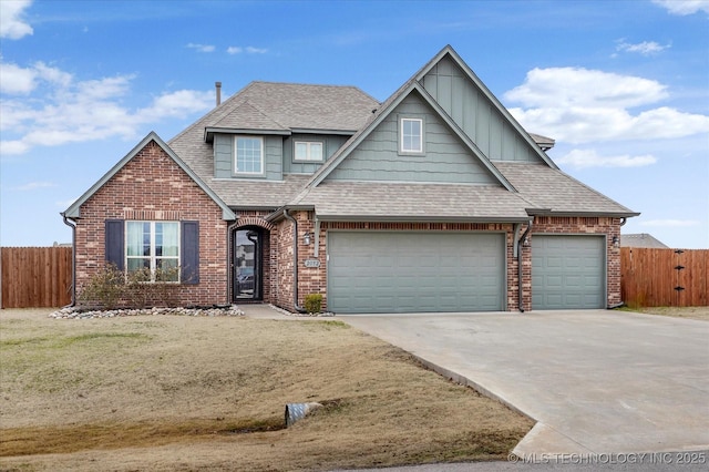 view of front of home with a garage and a front lawn