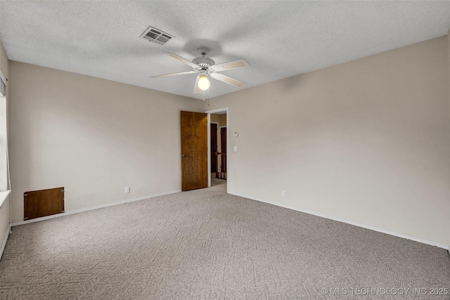 unfurnished room with carpet floors, a textured ceiling, and ceiling fan