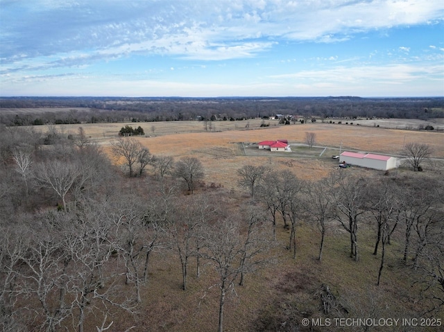 birds eye view of property with a rural view