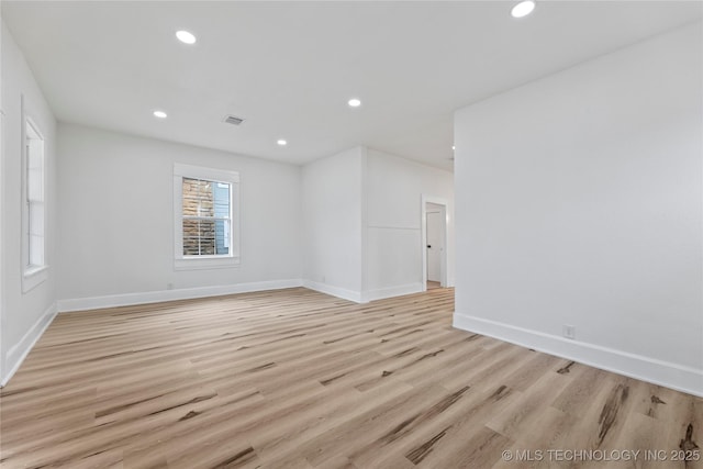 empty room with light wood-type flooring