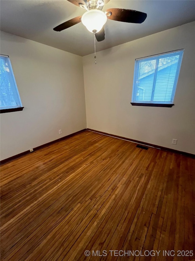 503 Parkview Dr, Bartlesville, OK 74003 - spare room with hardwood / wood-style floors, a ceiling fan, and baseboards