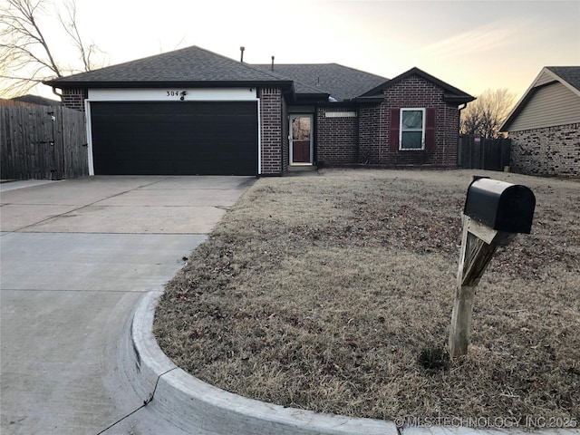 ranch-style house featuring a garage