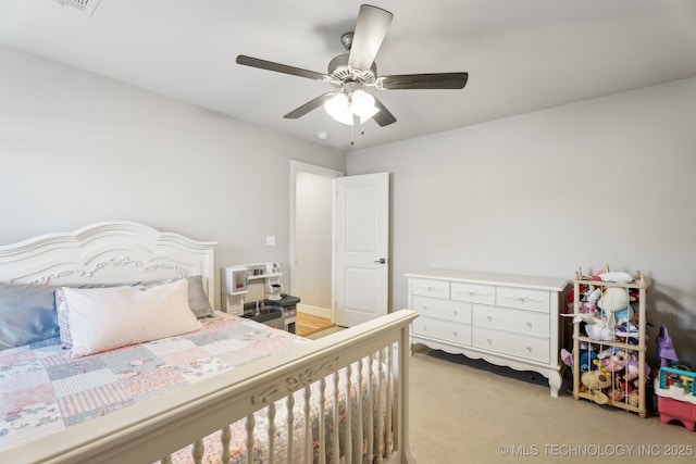 bedroom featuring light carpet and a ceiling fan