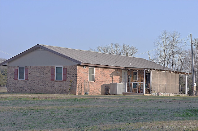 rear view of house with a lawn