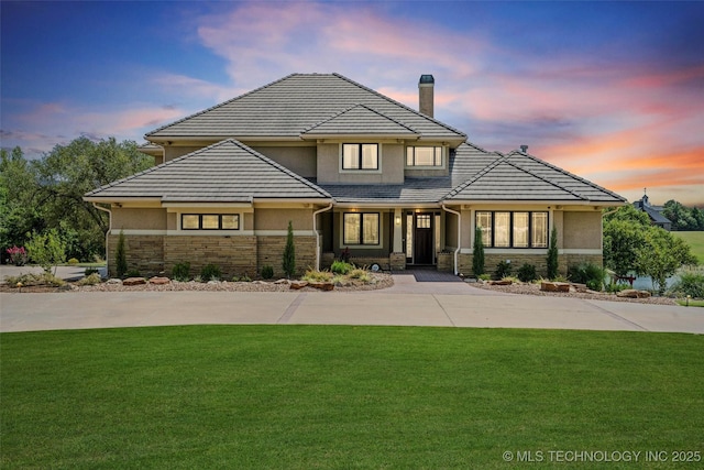 view of front of house with a yard