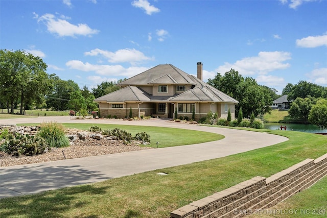 view of front of house featuring a water view and a front yard