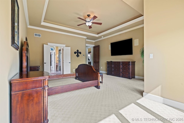 carpeted bedroom featuring crown molding, ceiling fan, and a tray ceiling