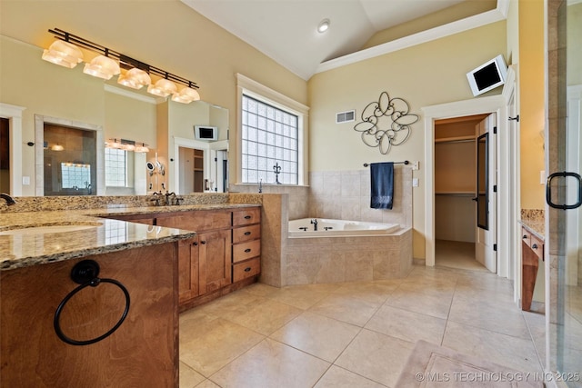 bathroom with vanity, high vaulted ceiling, tile patterned floors, and plus walk in shower