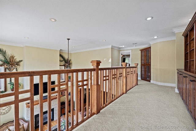 hallway featuring ornamental molding and light colored carpet