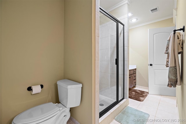 bathroom featuring tile patterned flooring, vanity, ornamental molding, a shower with shower door, and toilet