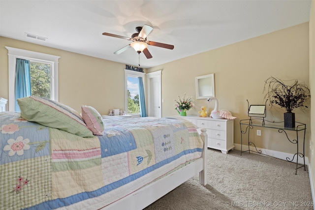 bedroom featuring light colored carpet and ceiling fan