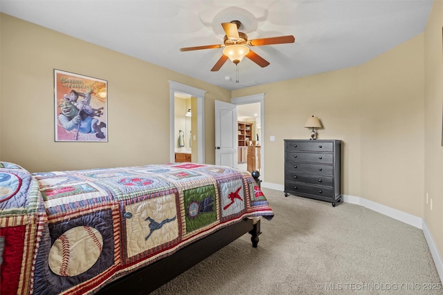 bedroom featuring ceiling fan, light colored carpet, and ensuite bathroom