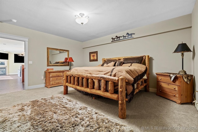 bedroom featuring light colored carpet