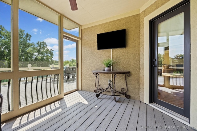 sunroom / solarium with ceiling fan