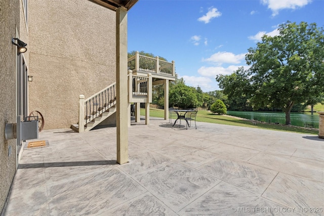 view of patio / terrace featuring a water view