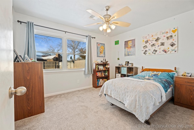 bedroom with light carpet and ceiling fan