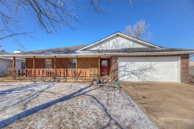 single story home featuring a garage and a porch