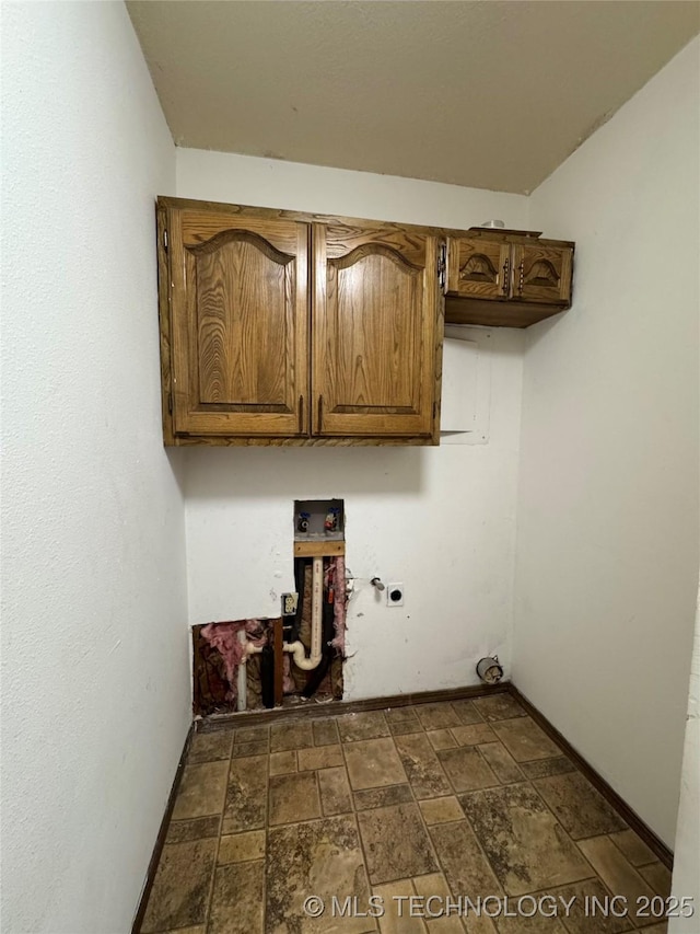 washroom featuring washer hookup, electric dryer hookup, hookup for a gas dryer, and cabinets