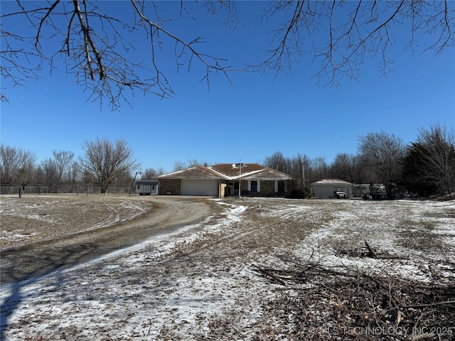 single story home with a garage