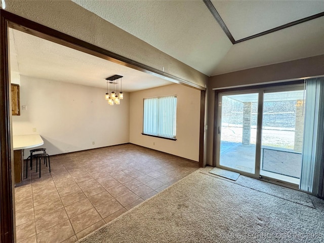 spare room featuring light tile patterned flooring, vaulted ceiling, a chandelier, and a textured ceiling