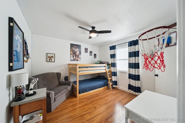 bedroom with wood-type flooring and ceiling fan