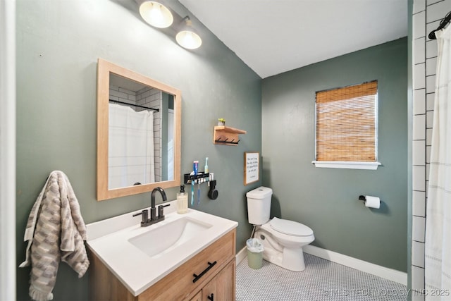 bathroom featuring tile patterned flooring, vanity, curtained shower, and toilet