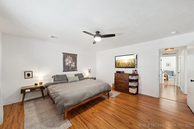 bedroom featuring wood-type flooring and ceiling fan