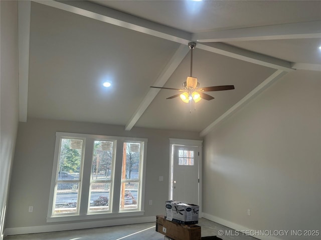 foyer featuring lofted ceiling with beams and ceiling fan