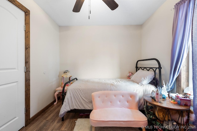 bedroom with dark wood-type flooring and ceiling fan