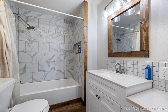 full bathroom with toilet, tasteful backsplash, vanity, shower / bath combo, and hardwood / wood-style flooring