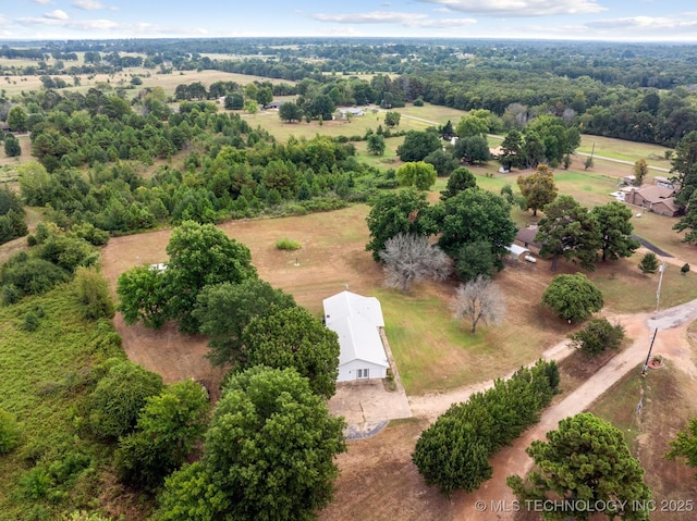 birds eye view of property with a rural view