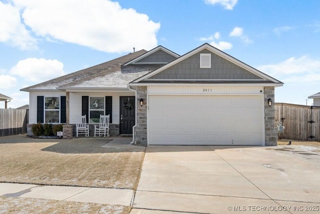 craftsman-style house with a garage and covered porch