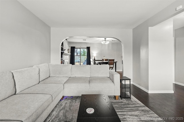 living room with dark hardwood / wood-style flooring